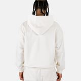 Rückansicht eines männlichen Models im Squeqo Essential Oversized Zip Hoodie in Off-White.