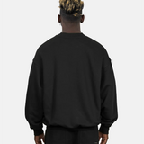 Rückansicht des SQUEQO Oversized Sweatshirts in Schwarz